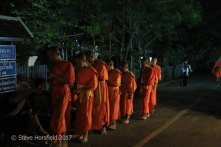 Monks receiving Tak Bat