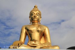 Buddha statue next to the Mekong river